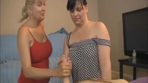 Two milfs jerking a naked guy