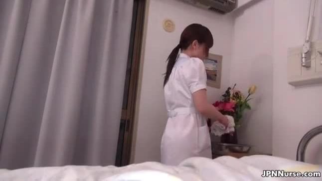 Sexy asian nurse sucks on a cock