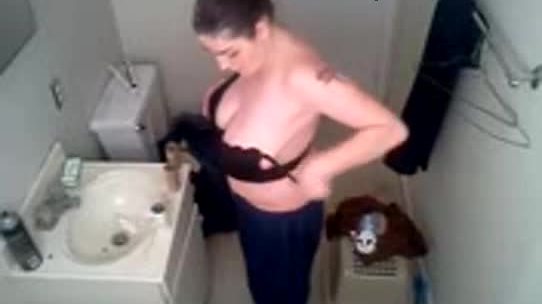 Amanda suttels changing in the bathroom